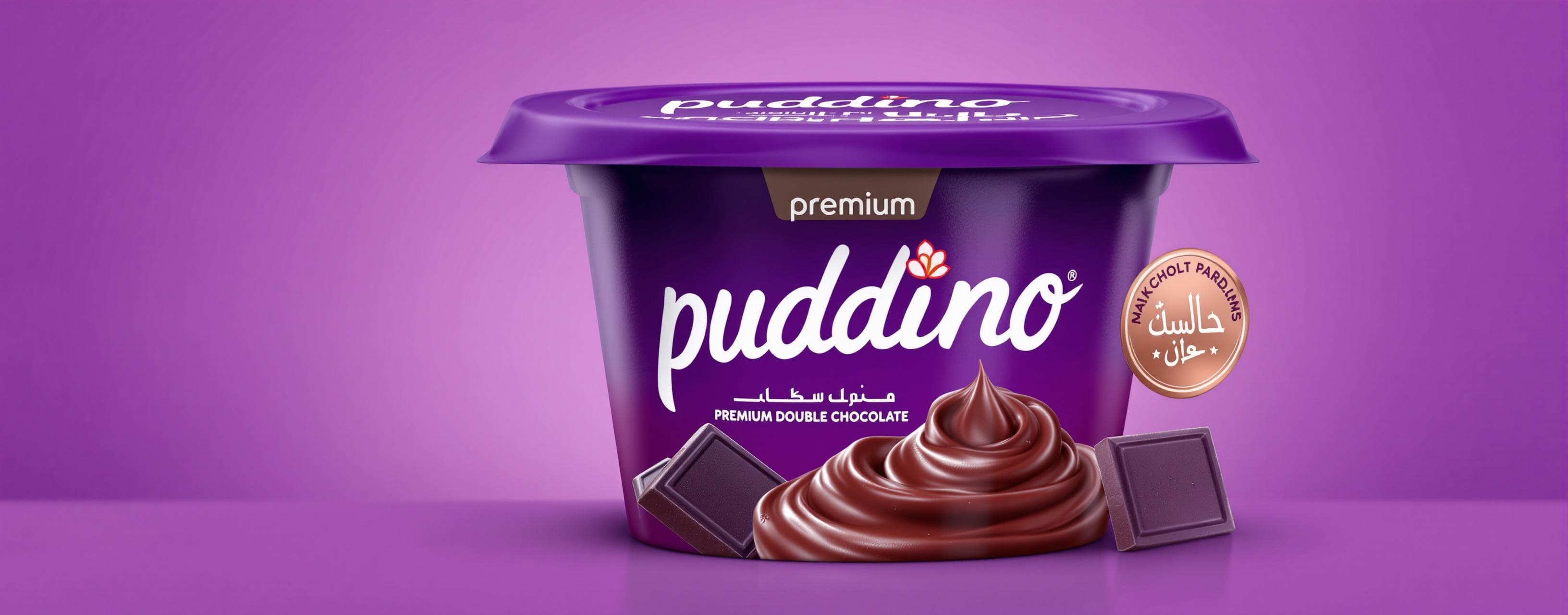 dark purple plastic container with curved sides, resembling a yogurt pack of premium double  chocolate pudding, extending it towards the upper left corner of the frame. The container  features the word "pudding" in a large, white, cursive font in the center, with "premium" written  above it in a smaller, light purple, sans-serif font. To the left of "premium" is a logo with white  Arabic script above a stylized flower. On the right side of the container is a circular gold seal  with white Arabic writing. Below the "pudding" text is a photographic depiction of chocolate  pudding and two dark chocolate squares. The lighting and shadows are carefully rendered to  make the pudding container appear realistically integrated into the scene, maintaining its  original scale and contributing to a playful, vibrant tone