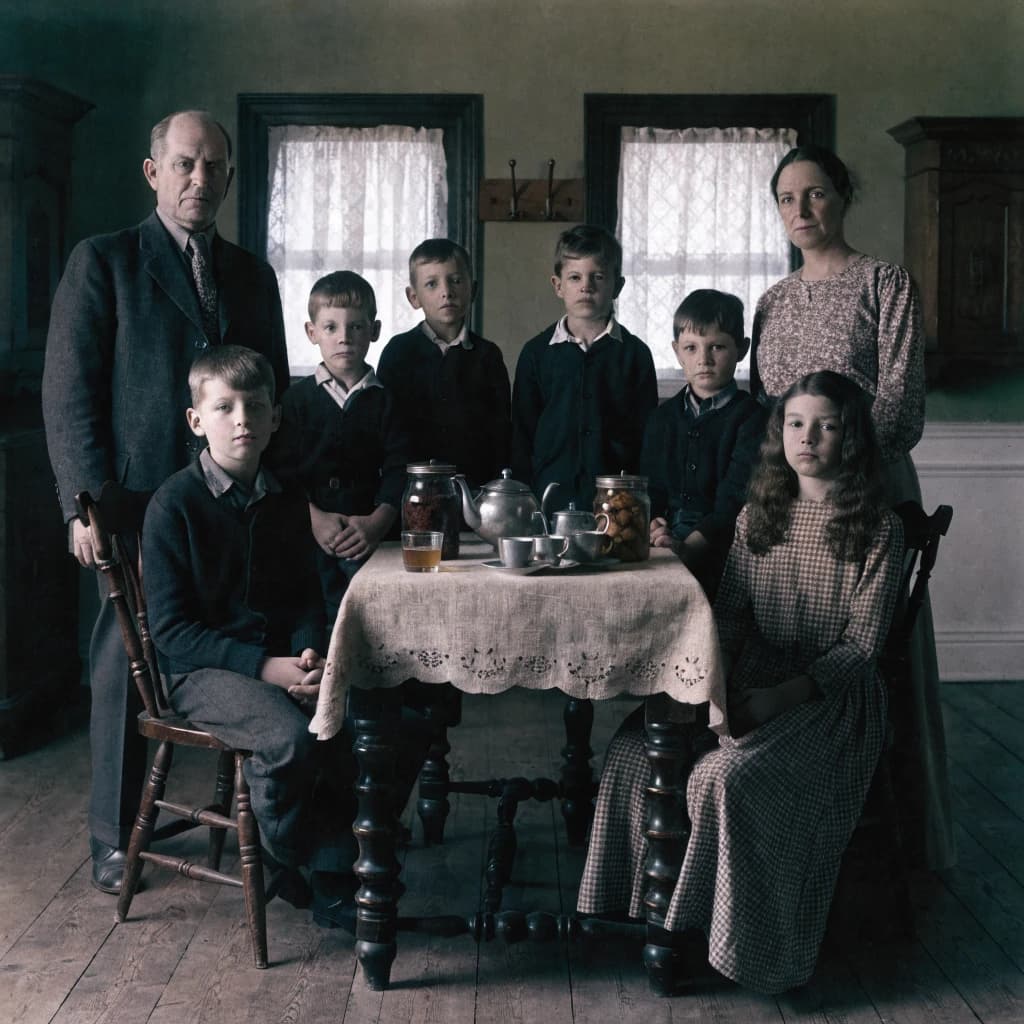 Everybody holds still and nobody smiles for the family portrait. It's 1928 in Kansas