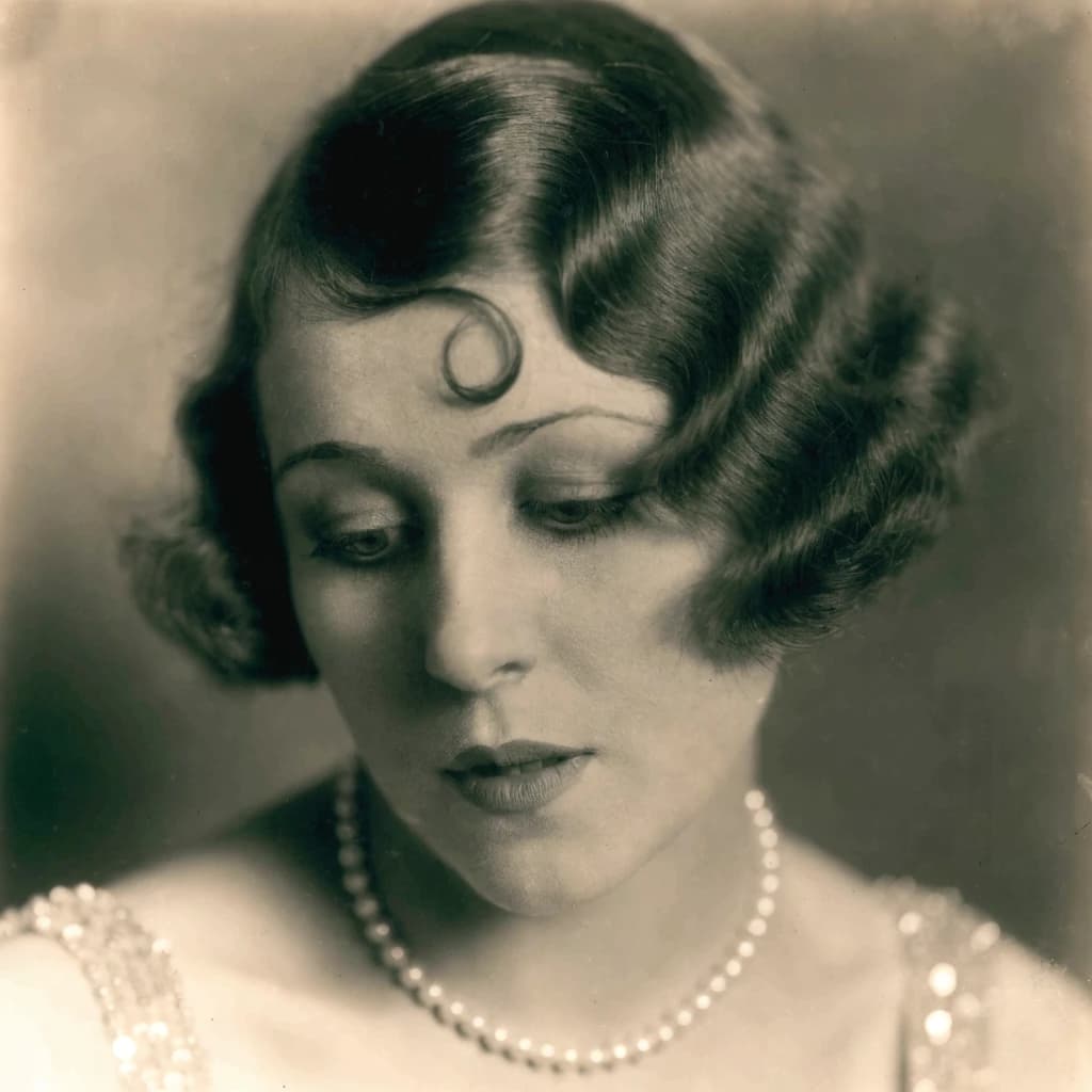 Sepia-toned studio portrait of a flapper with pearl necklace, soft grain.