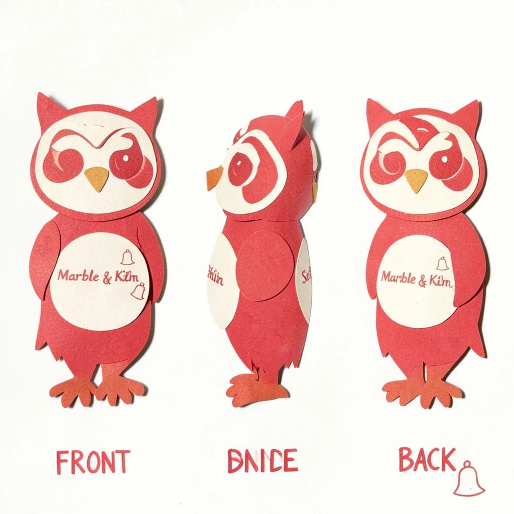 Cut-paper collage of the same bookstore owl mascot drawn in three views, captioned "front", "side" and "back", every view carrying the wordmark "Marble & Kiln" with a small bell outline beside it in the same red-and-cream coloring, only the angle changing.